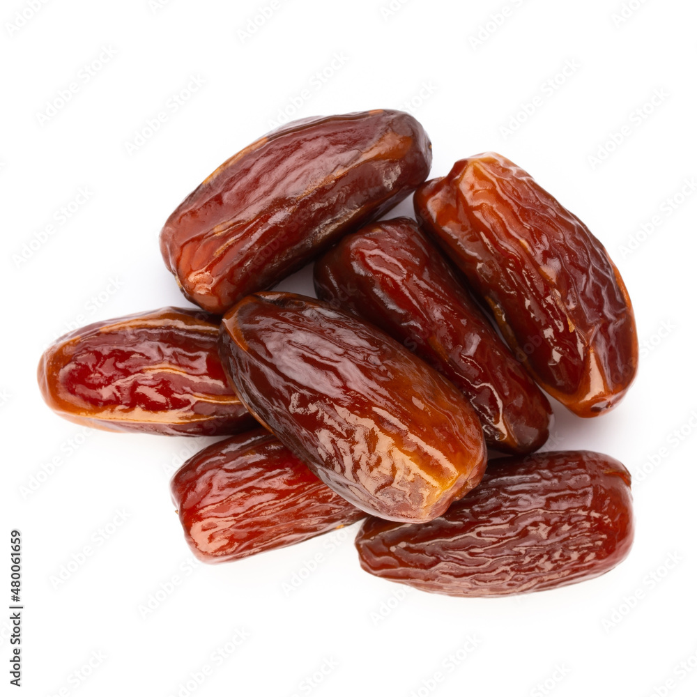Dry dates isolated on white background. Top view. Flat lay pattern. Dry dates isolated on white background. Top view. Flat lay pattern.