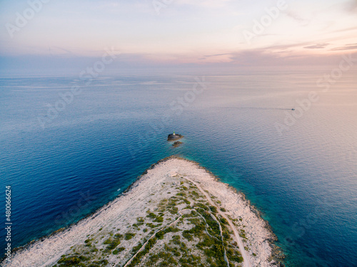 Lighthouse on the island opposite the Punta Planca headland. Drone photo