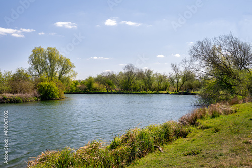 Walking along the river Thames in Oxfordshire on a sunny spring day