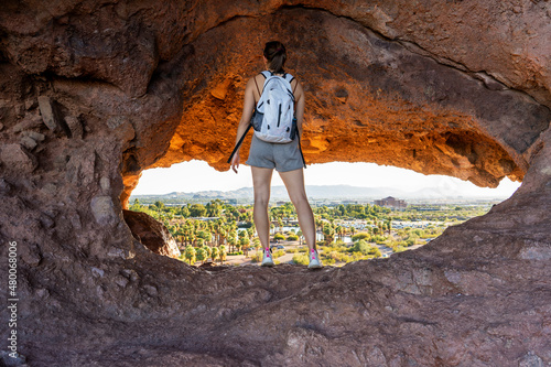 The view of Phoenix through the Hole-in-the-rock at Papago Park in Phoenix, Arizona