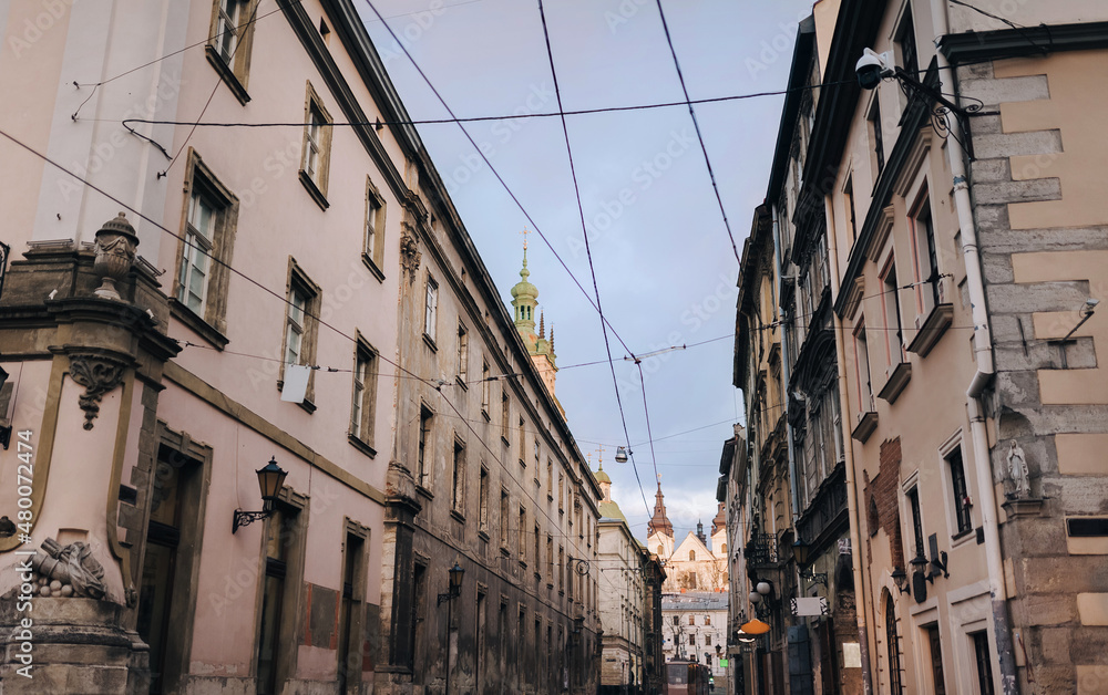 Evening view of the old street of the European city. Facades and windows of the historical part of Lviv, Ukraine.