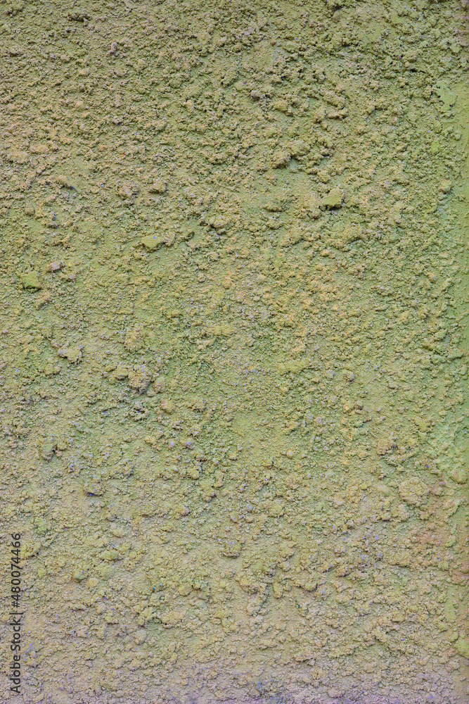 Front view of concrete or plaster wall with rough surface shows beautiful natural green color and surface texture of vintage and grunge building structure. It is beautiful abstract background. Front view of concrete or plaster wall with rough surface shows beautiful natural green color and surface texture of vintage and grunge building structure. It is beautiful abstract background.