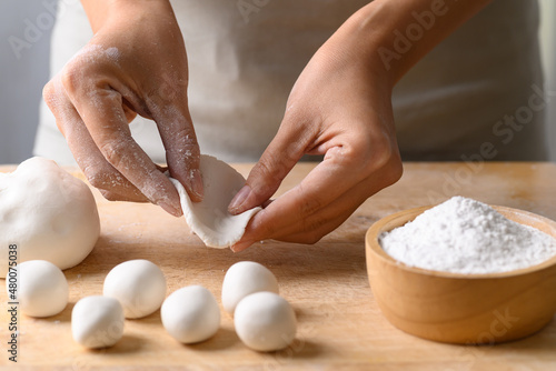 Hand making Tangyuan, Chinese dessert made of ball glutinous rice flour photo