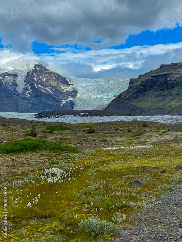 Beautiful Cinematic Aerial view of the massive Svinafellsjokull Glacier in Iceland and its lagoon caused by global warming