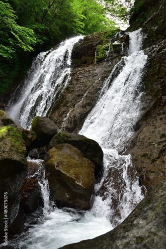 trekking around waterfall in summer