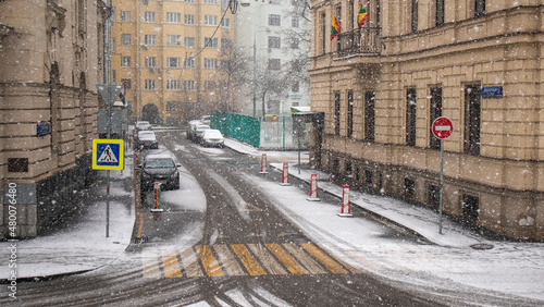 Snowfall on road and crosswalk