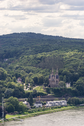 Aerial view from Erpeler Ley at church of St Apollinaris surrounded by forest in front of the river rhine, Remagen, Germany