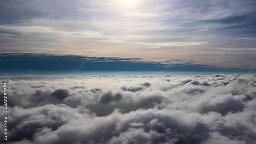 Aerial view from high altitude of earth covered with puffy rainy clouds forming before rainstorm Aerial view from high altitude of earth covered with puffy rainy clouds forming before rainstorm