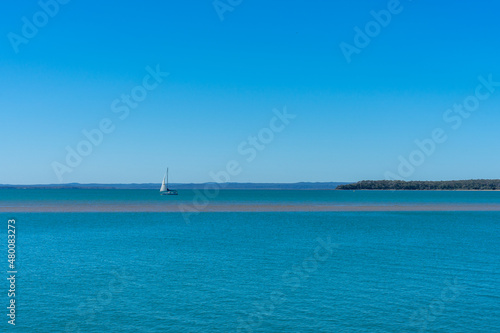 Panoramic seascape with a sailing boat
