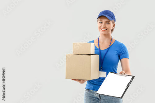 Female courier with parcels...