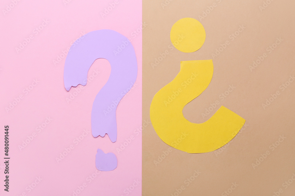Question marks made of paper on color background Question marks made of paper on color background