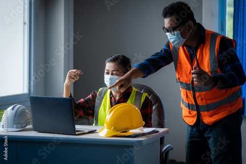 Team engineer wearing facemasks during coronavirus and flu outbreak working at construction site,Virus protection,COVID-2019.