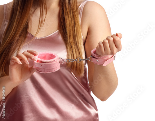 Young woman with handcuffs ...