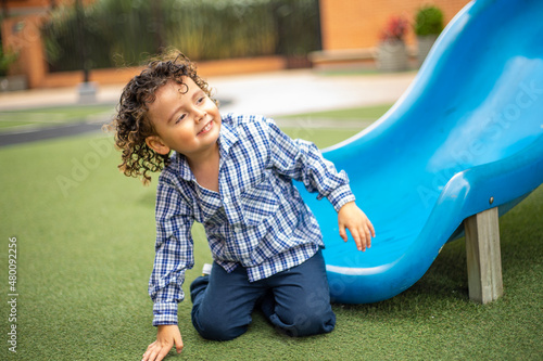 Cute little boy playing happily in the park