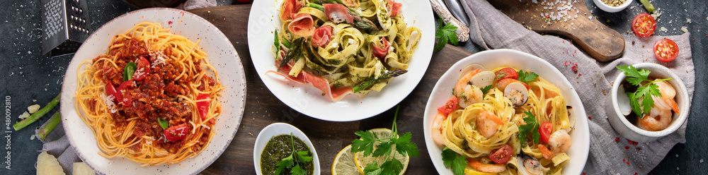 Pasta assortment on dark background. Pasta assortment on dark background.