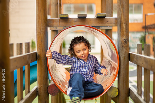 Cute little boy playing happily in the park