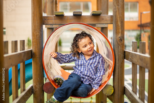 Cute little boy playing happily in the park