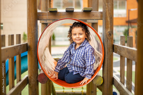 Cute little boy playing happily in the park