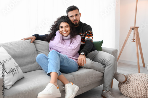 Happy young couple wearing ...