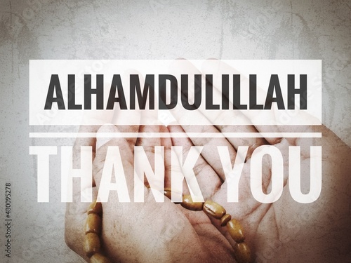 Islamic quote. Phrase Alhamdulillah or thank you with blurry background. photo