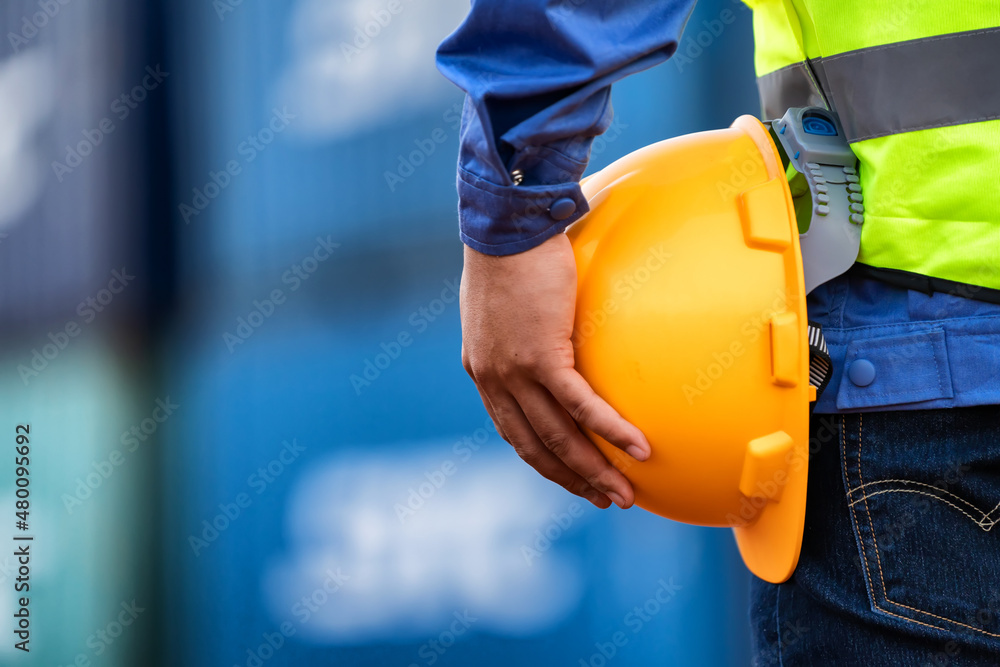 Industry workers stand with yellow protective hats. Industry workers stand with yellow protective hats.