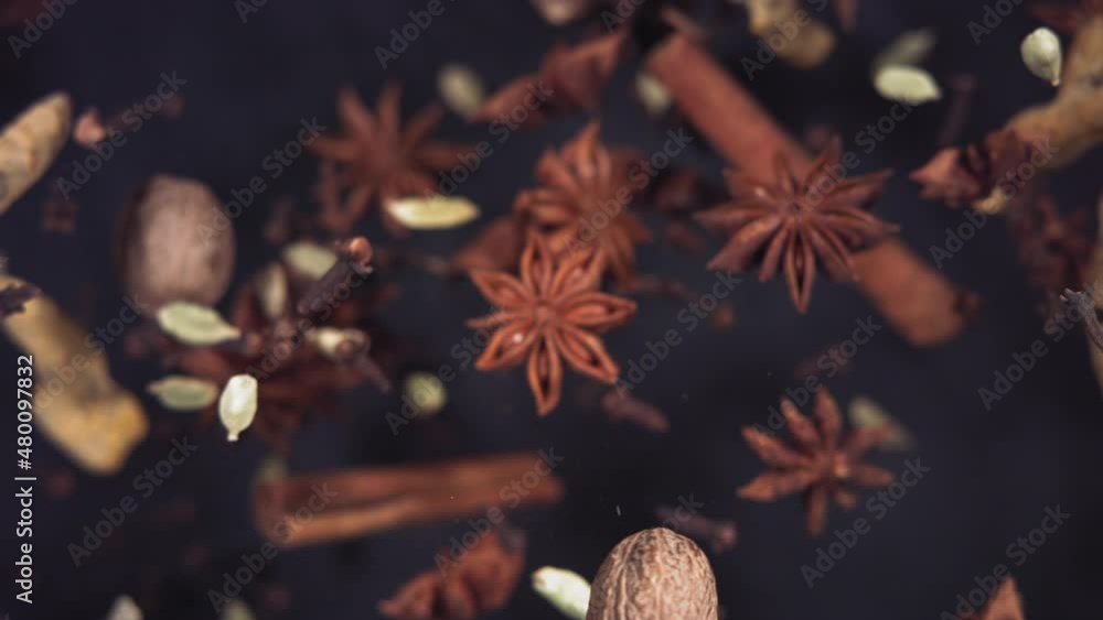 Super slow motion of flying Spices. Filmed in lack background