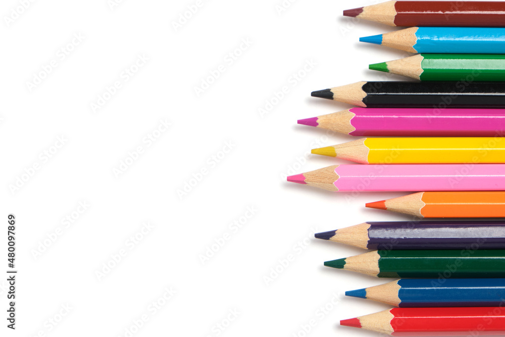 Bright colored pencils on a white background.School supplies for drawing. Bright colored pencils on a white background.School supplies for drawing.