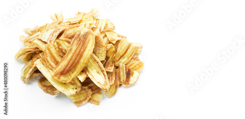 Asian caltivated banana or pisang awak banana cracker ro banana chips on white background, soft and selective focus.