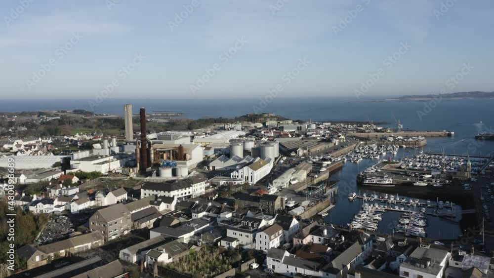 Flight from Leale’s yard towards vale Castle Guernsey including the Bridge,St Sampson, Marina, harbour,power station, M and G boatyard, Quayside,Northside and commercial wharf on calm sunny day Flight from Leale’s yard towards vale Castle Guernsey including the Bridge,St Sampson, Marina, harbour,power station, M and G boatyard, Quayside,Northside and commercial wharf on calm sunny day