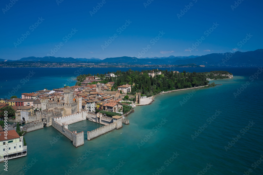 Sirmione, Lake Garda, Italy. Aerial view of Sirmione Castle. In the background blue sky, sunny day, good weather