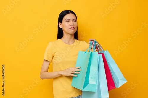 woman with packages in hands shopping isolated background unaltered