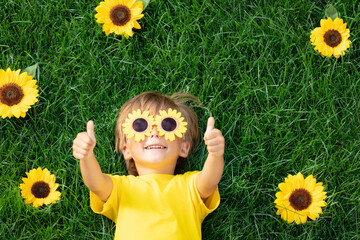 Happy child playing outdoor in spring park