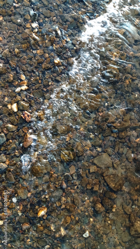 Close up view of smooth round pebble stones on the beach. Close up view of smooth round pebble stones on the beach.
