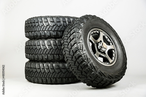 suv wheels are on a gray background.  set of mud wheels, studio shot. off-road tires close up