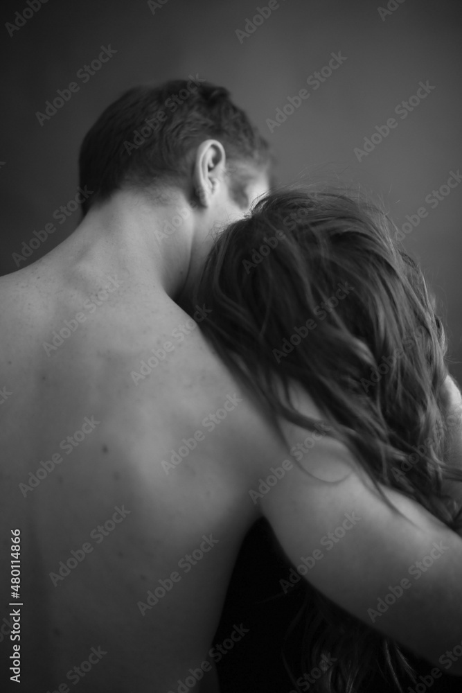 Sensual touches between a man and a woman, a beautiful fashion portrait of a couple, body details with a slight element of eroticism. A place for text and a blurred fleur of love Sensual touches between a man and a woman, a beautiful fashion portrait of a couple, body details with a slight element of eroticism. A place for text and a blurred fleur of love