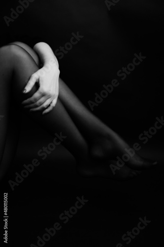 female body details close-up, black and white frame , defocusing