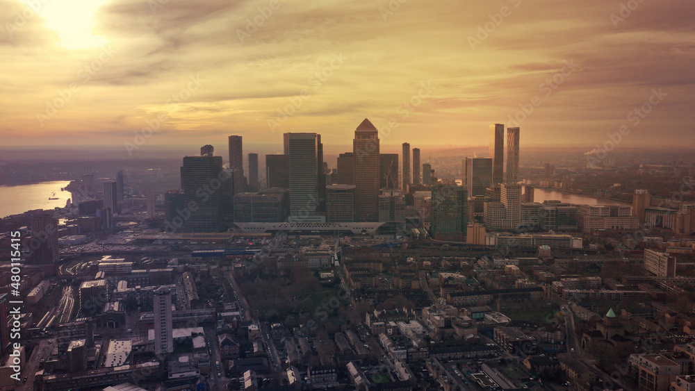Obraz premium Aerial drone photo of iconic skyscraper banking and business complex of Canary Wharf at sunset, Docklands, London, United Kingdom