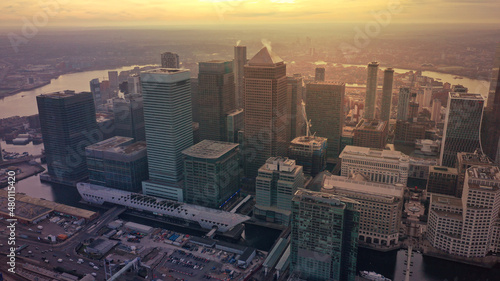 Aerial drone photo of iconic skyscraper banking and business complex of Canary Wharf at sunset, Docklands, London, United Kingdom