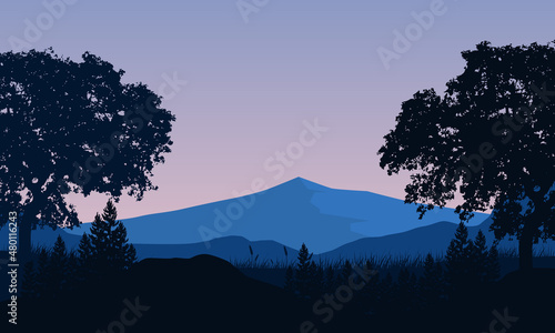 Fantastic mountain panorama with village tree silhouettes at night