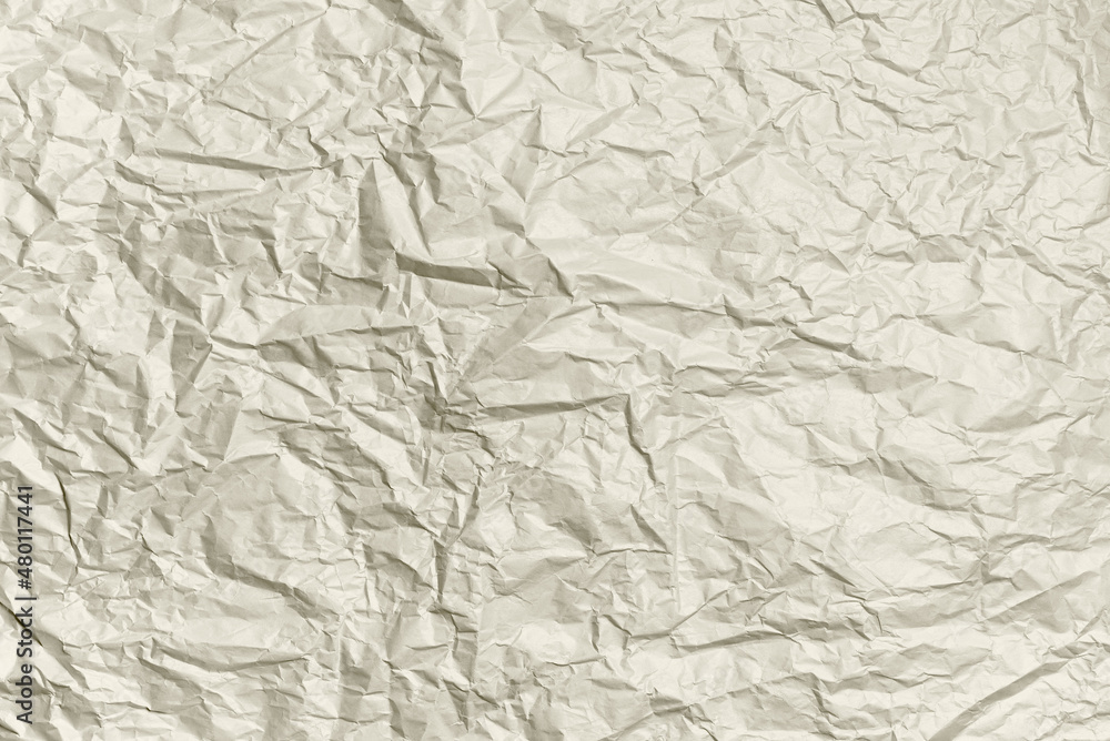 Crumpled paper ivory color texture. Abstract background. Mockup for your design.