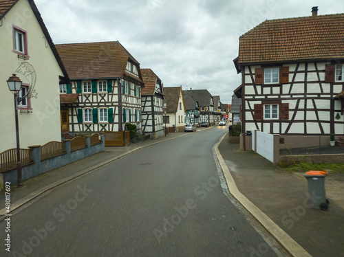 view from the car window on the street with houses in France in the city of Betschdorf