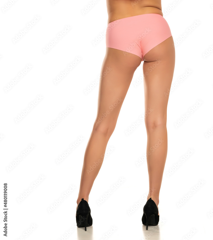 Rear view of pretty female legs in pink panties and high heels Rear view of pretty female legs in pink panties and high heels