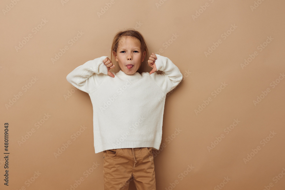 little girl in white sweater posing hand gestures isolated background little girl in white sweater posing hand gestures isolated background
