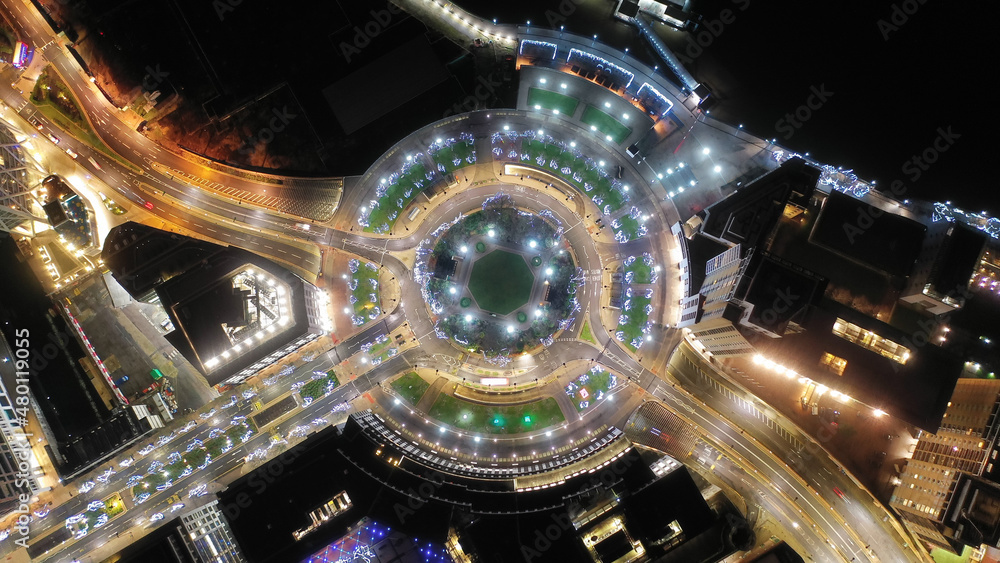 Aerial drone top down night shot of West ferry Circus square illuminated with Christmas lights in skyscraper banking and business complex of Canary Wharf, Docklands, London, United Kingdom Aerial drone top down night shot of West ferry Circus square illuminated with Christmas lights in skyscraper banking and business complex of Canary Wharf, Docklands, London, United Kingdom