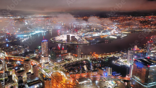Photography Aerial drone night shot of iconic illuminated with Christmas lights skyscraper b