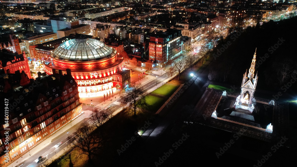 Obraz premium Aerial drone night shot of illuminated Royal Albert hall and Albert Memorial in Kensington area, London, United Kingdom