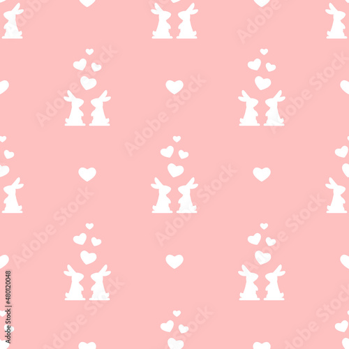 Seamless love pattern with rabbits and hearts on pink background. Decorative holiday wallpaper, good for printing.