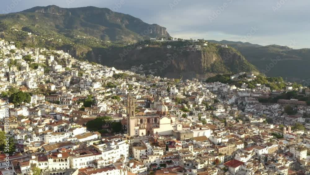 Aerial view of Taxco de Alarcon, Guerrero State, Mexico, hillside cityscape on sunny day, drone shot 60fps Aerial view of Taxco de Alarcon, Guerrero State, Mexico, hillside cityscape on sunny day, drone shot 60fps