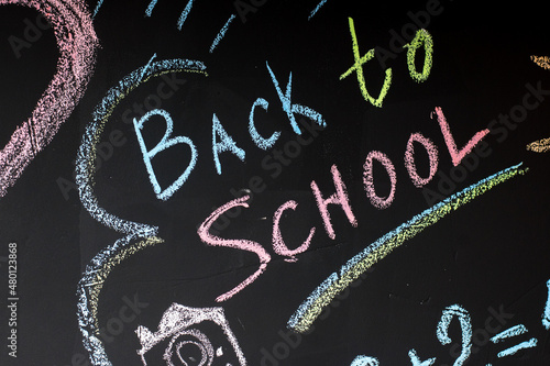 school board with numbers and drawings drawn in chalk. back to school