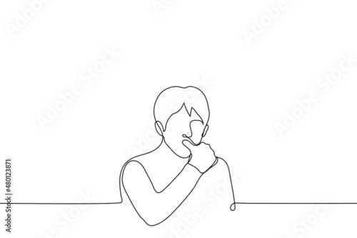man licks his finger - one line drawing vector. concept of licking fingers after delicious meal, biting fingers from nerves, biting off hangnail or splinter photo
